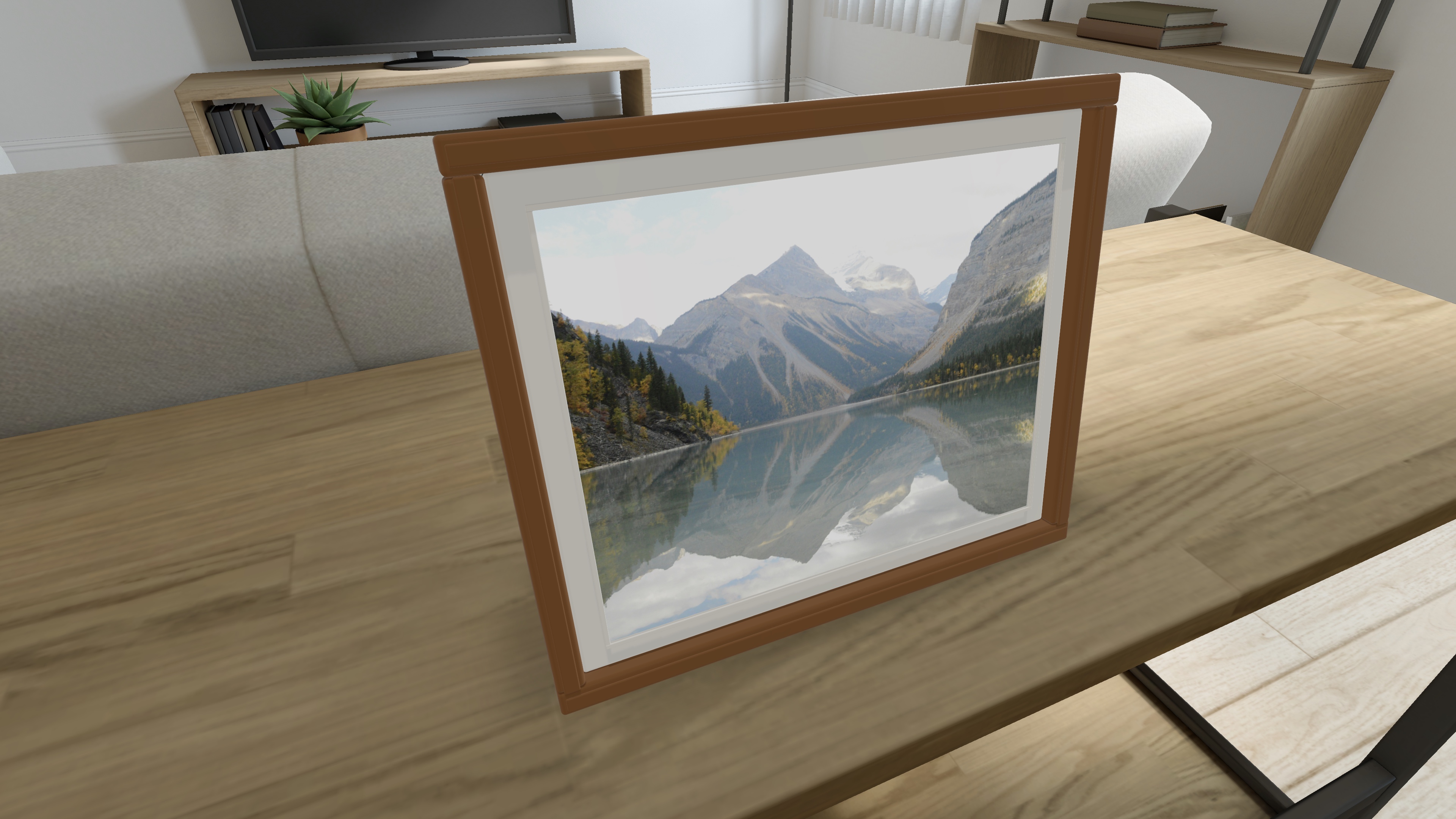 Aura Moments app screenshot: the same photo frame viewed at an angle on a simulator desk.