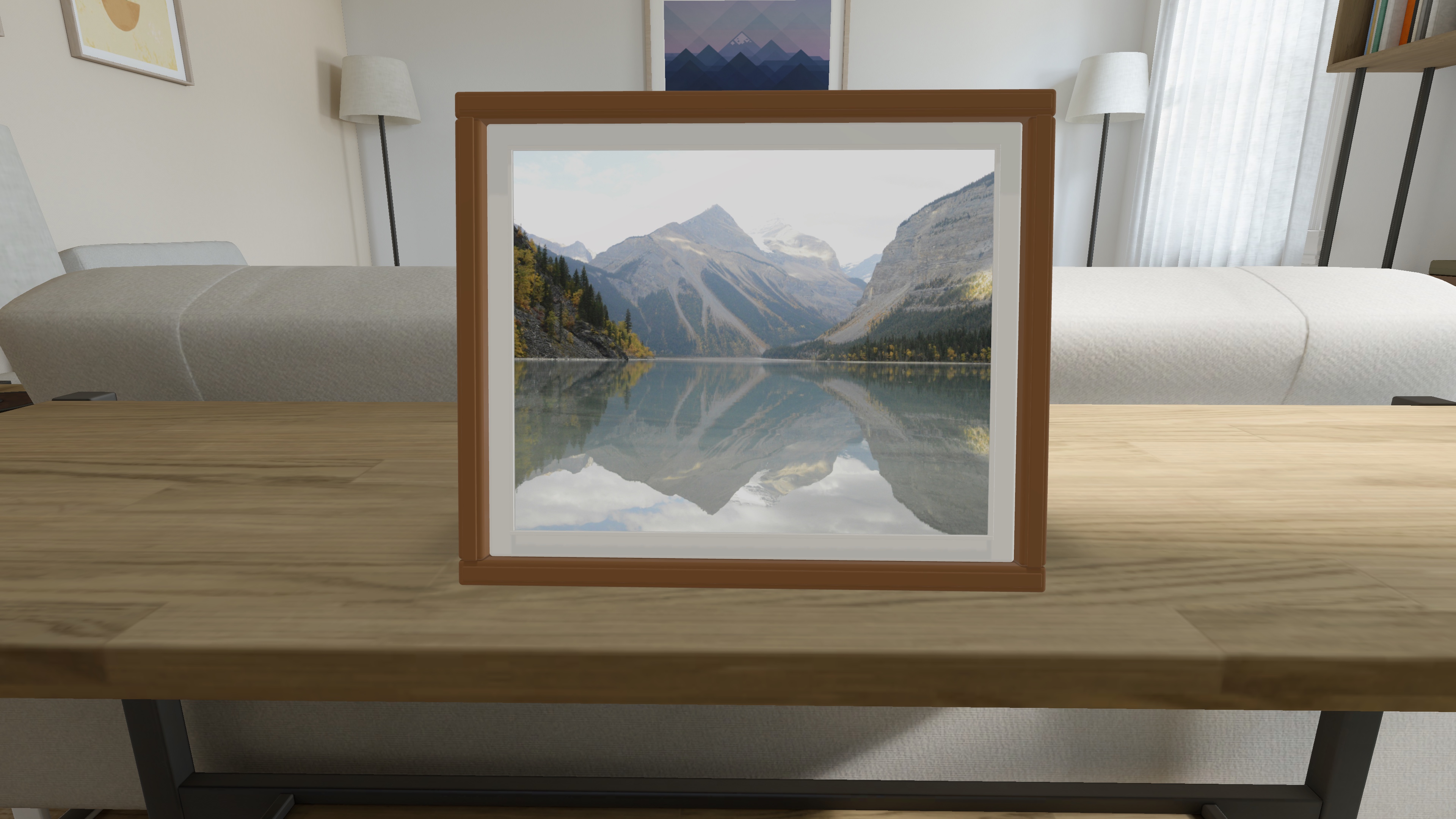 Aura Moments app screenshot: a wood-finish frame with a mountain lake photo, viewed from the front on a simulator desk.